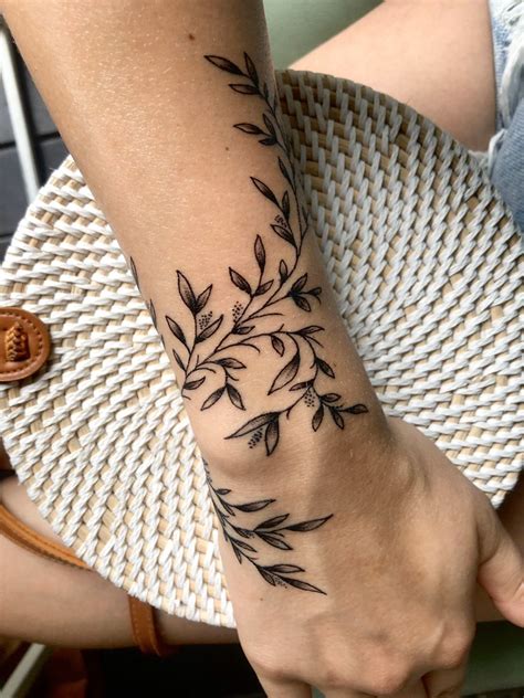 forearm vine tattoo|vine tattoo wrapped around wrist.